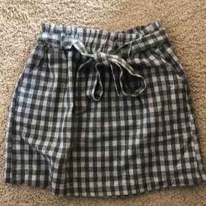 Plaid skirt with a tie bow in front